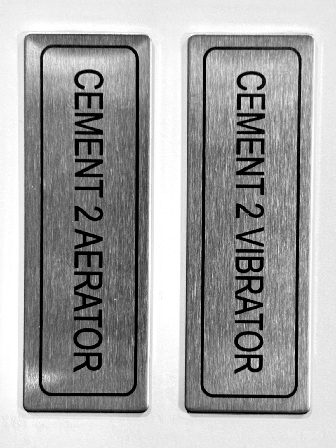 Brushed metal engraved equipment plates for cement vibrators